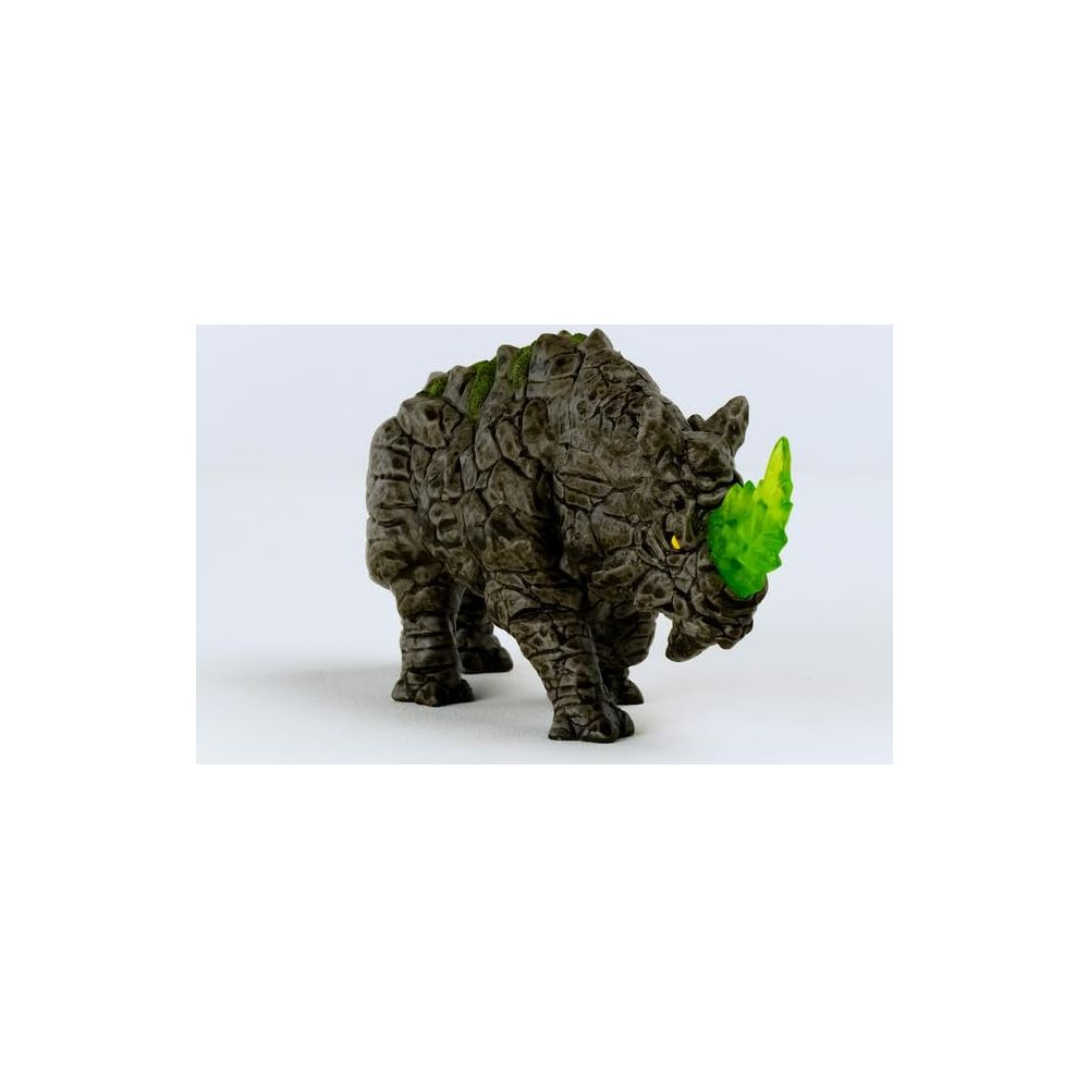 Szara zabawka nosorożca z zielonym pancerzem i jasnozielonym rogiem.