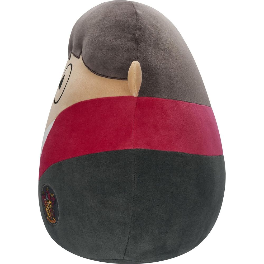 Ein Stofftier in Gryffindor-Farben mit einem Wappen auf der linken Seite.