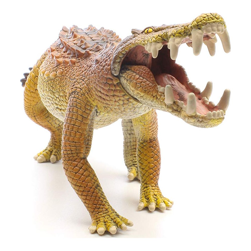 Żółta i brązowa figurka krokodyla z otwartą paszczą, pokazująca ostre zęby.