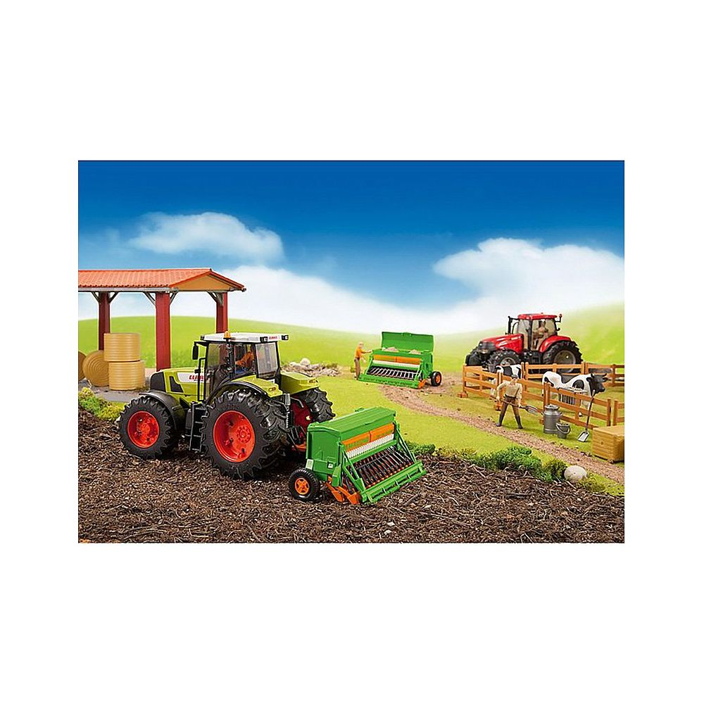 Zielony traktor z siewnikiem i czerwony traktor na farmie.