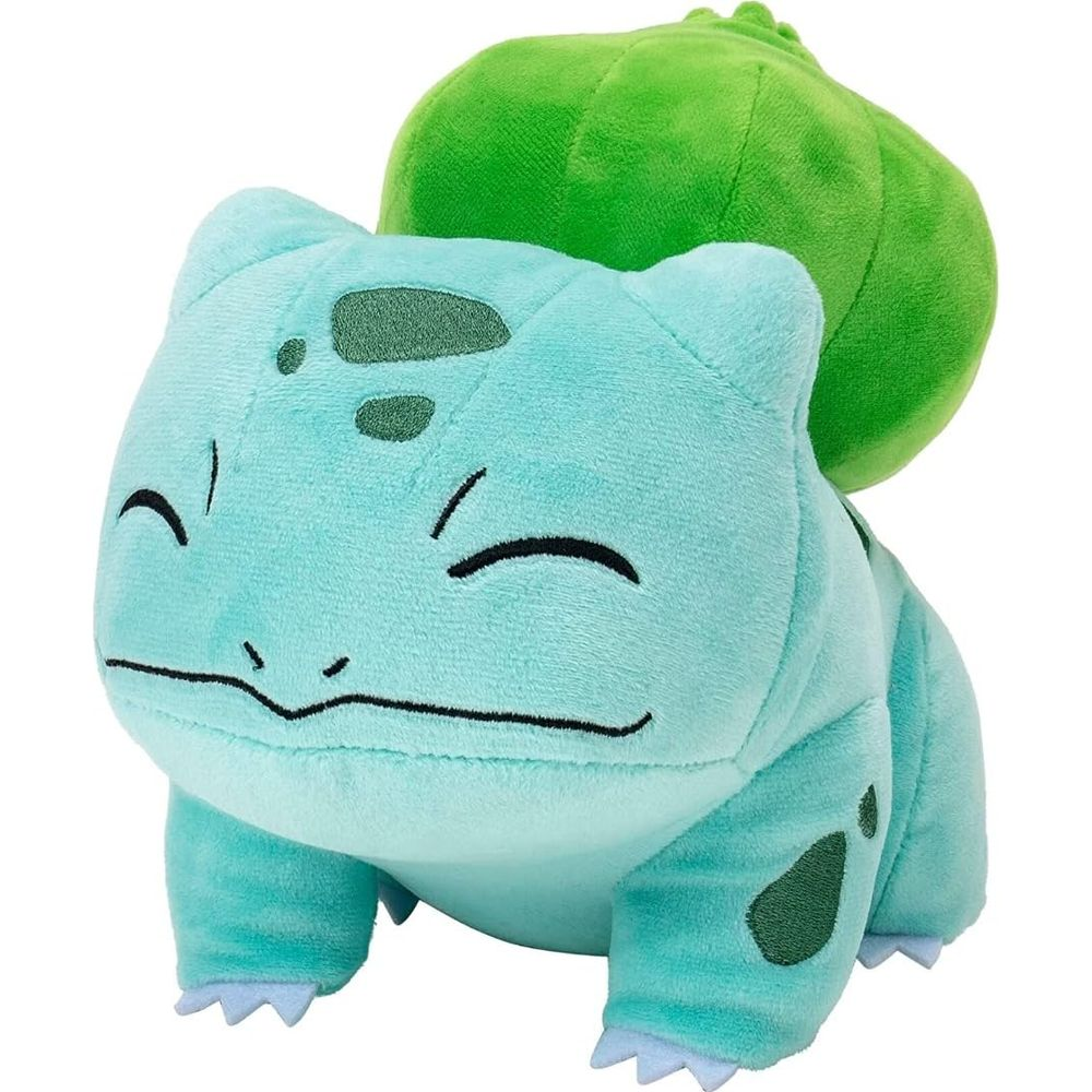 Un Bulbizarre en peluche vert clair avec un bulbe vert sur son dos.