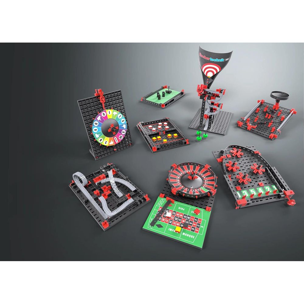 Kits Fischertechnik : roulette, cible, piste numérotée, piste à billes.