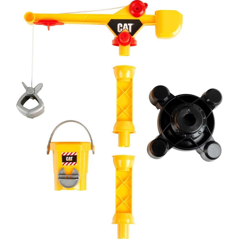 Żółte części zabawkowego dźwigu CAT: ramię dźwigu, wiadro, chwytak, podstawa i dwie sekcje.