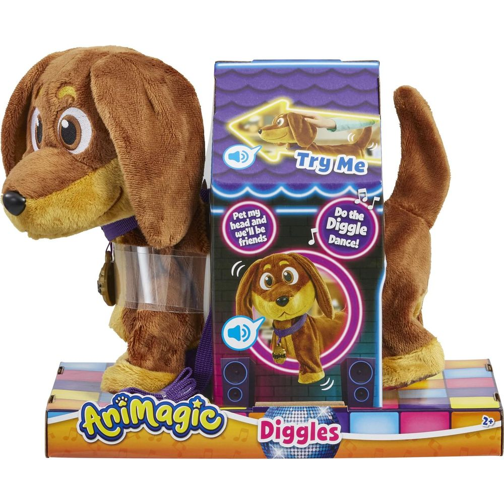 Un cane di peluche marrone di nome Diggles nella sua confezione. Dice 'Provalo'.