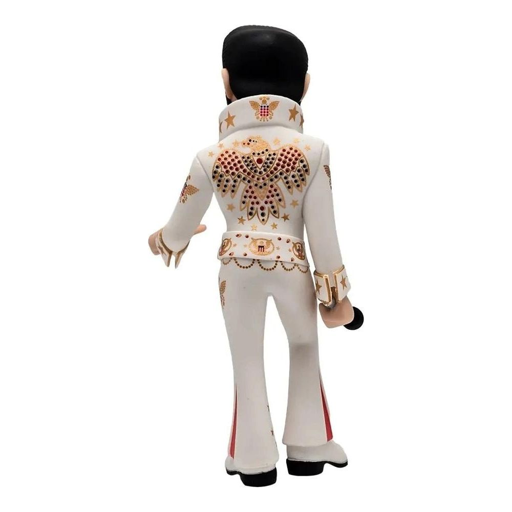 Una figura de Elvis con traje blanco, bordado de águila en la espalda y micrófono.