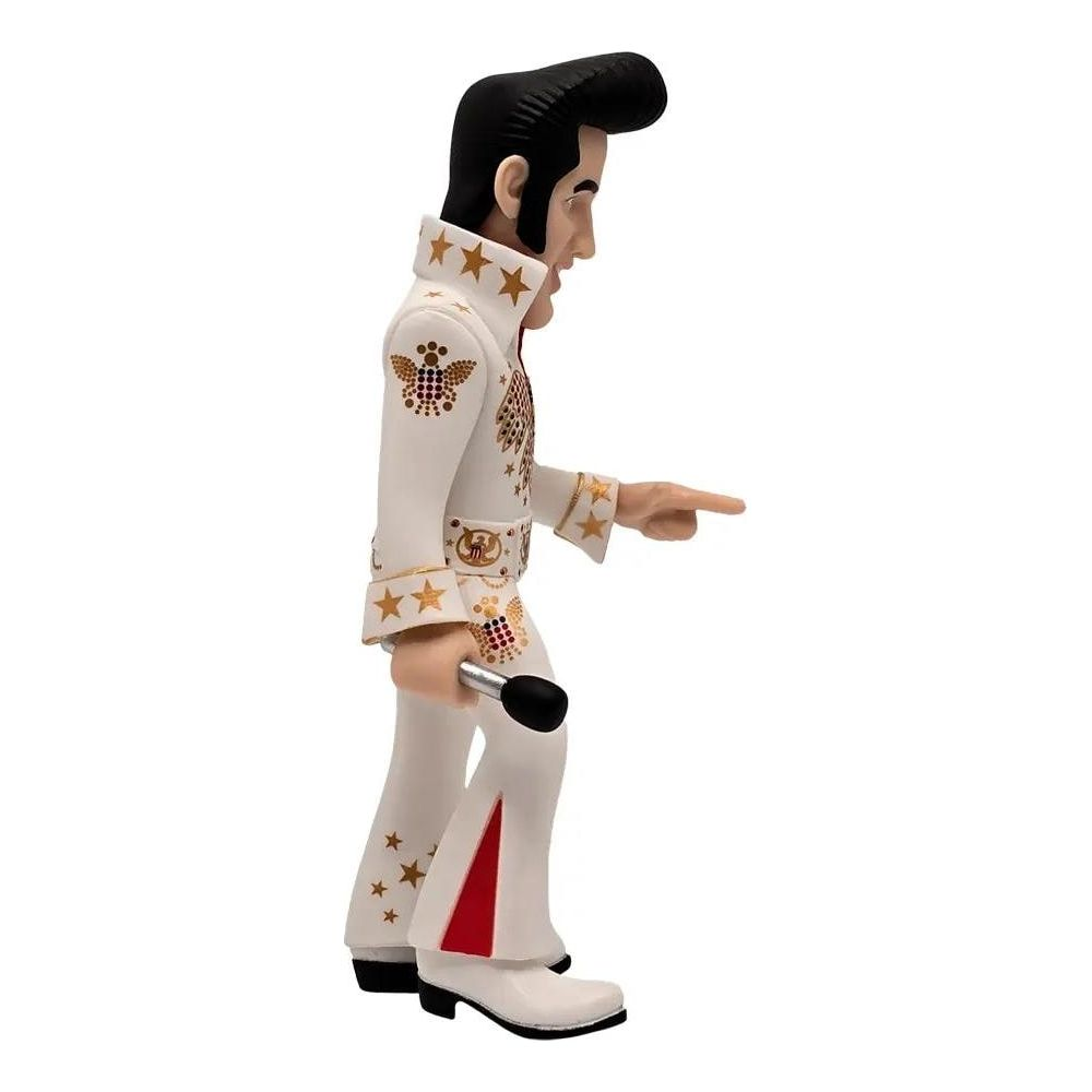 Una figura de Elvis Presley con traje blanco, estrellas y micrófono.