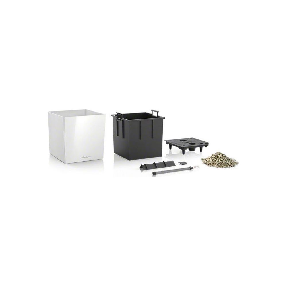 Un pot blanc, un insert noir, une grille, un tube et des granulés.