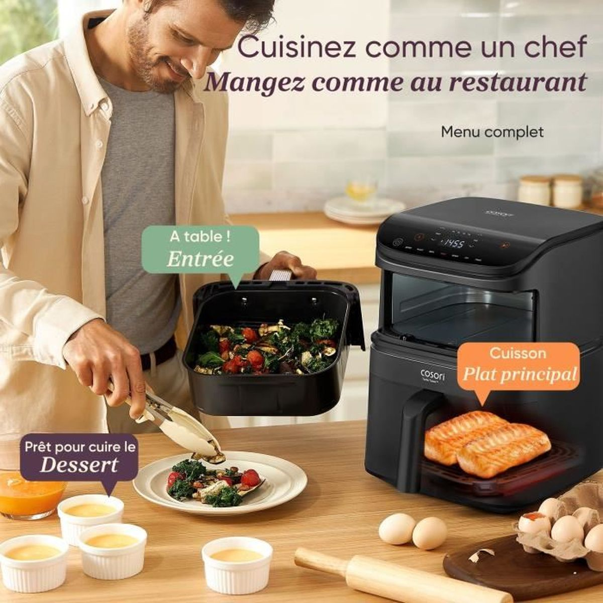 Mężczyzna z frytkownicą beztłuszczową serwuje warzywa. Łosoś gotuje się w frytkownicy.