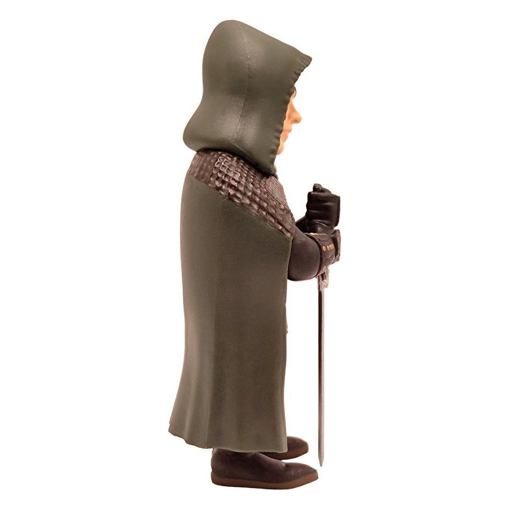 Una figura con capucha y espada, vista de lado.