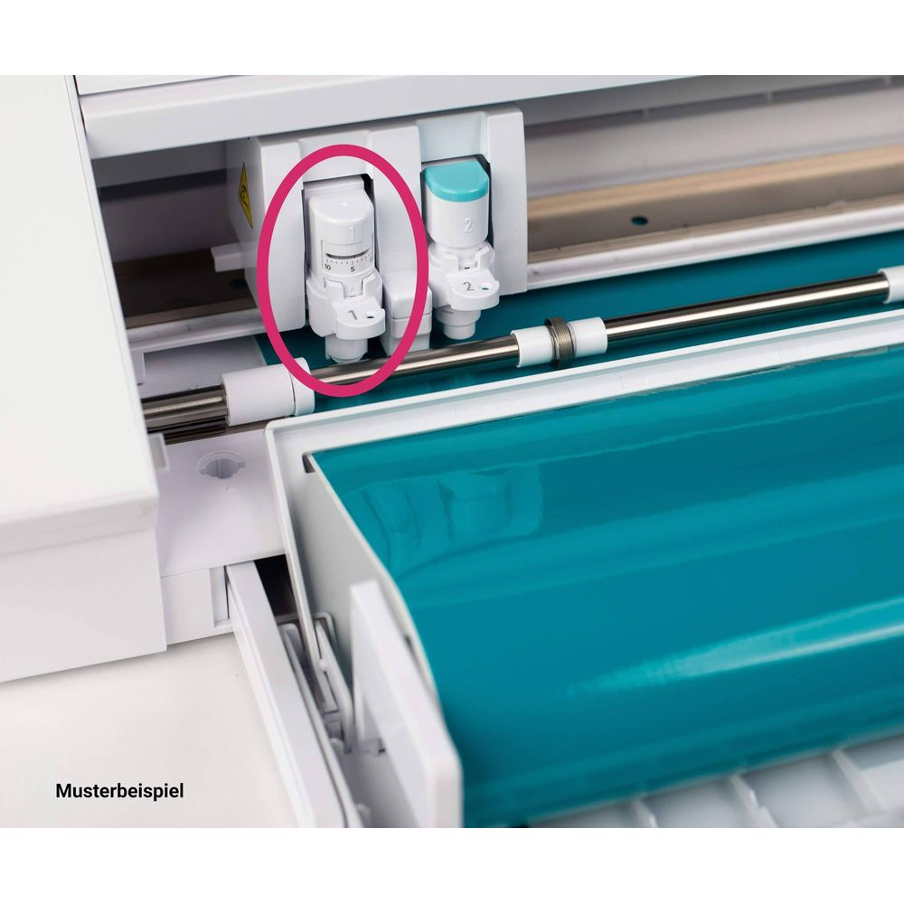 Detailansicht eines Schneidekopfes mit verstellbarem Rädchen, umgeben von einem Kreis.