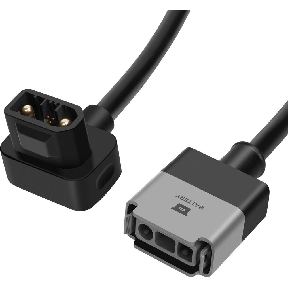 Dos conectores de cable negros con pines metálicos, uno etiquetado BATTERY.