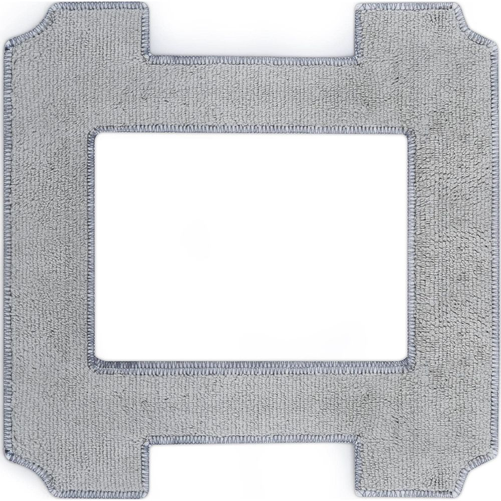 Szary dywan z prostokątnym wycięciem pośrodku.