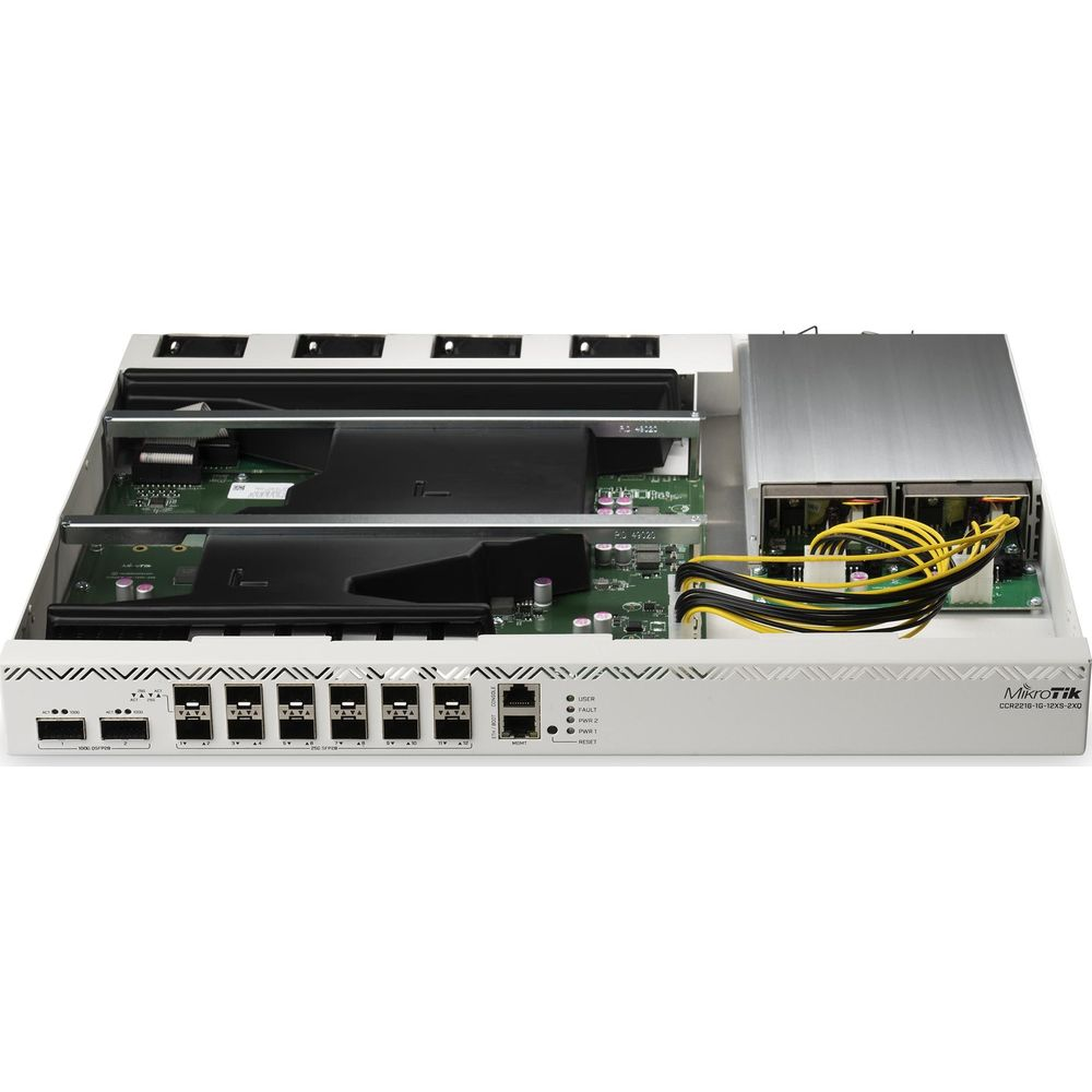 Router MikroTik z wieloma portami, zasilaczami i płytkami drukowanymi.