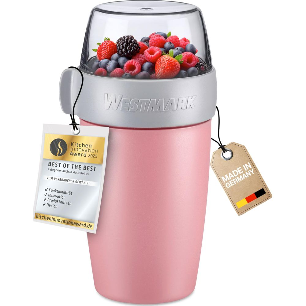 Ein rosa Westmark Mixer gefüllt mit Beeren, mit Auszeichnungen.