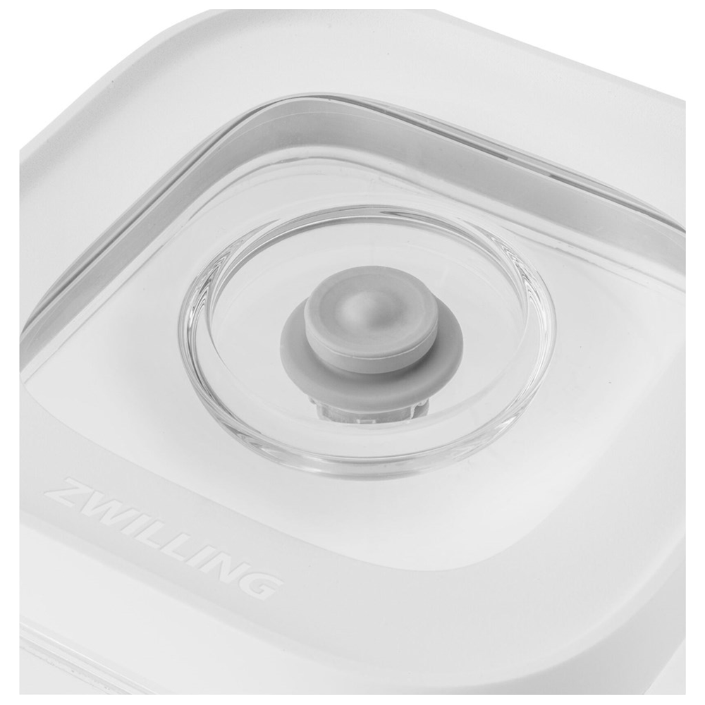 Caja de almacenamiento blanca con logo ZWILLING y válvula de vacío en la tapa transparente.