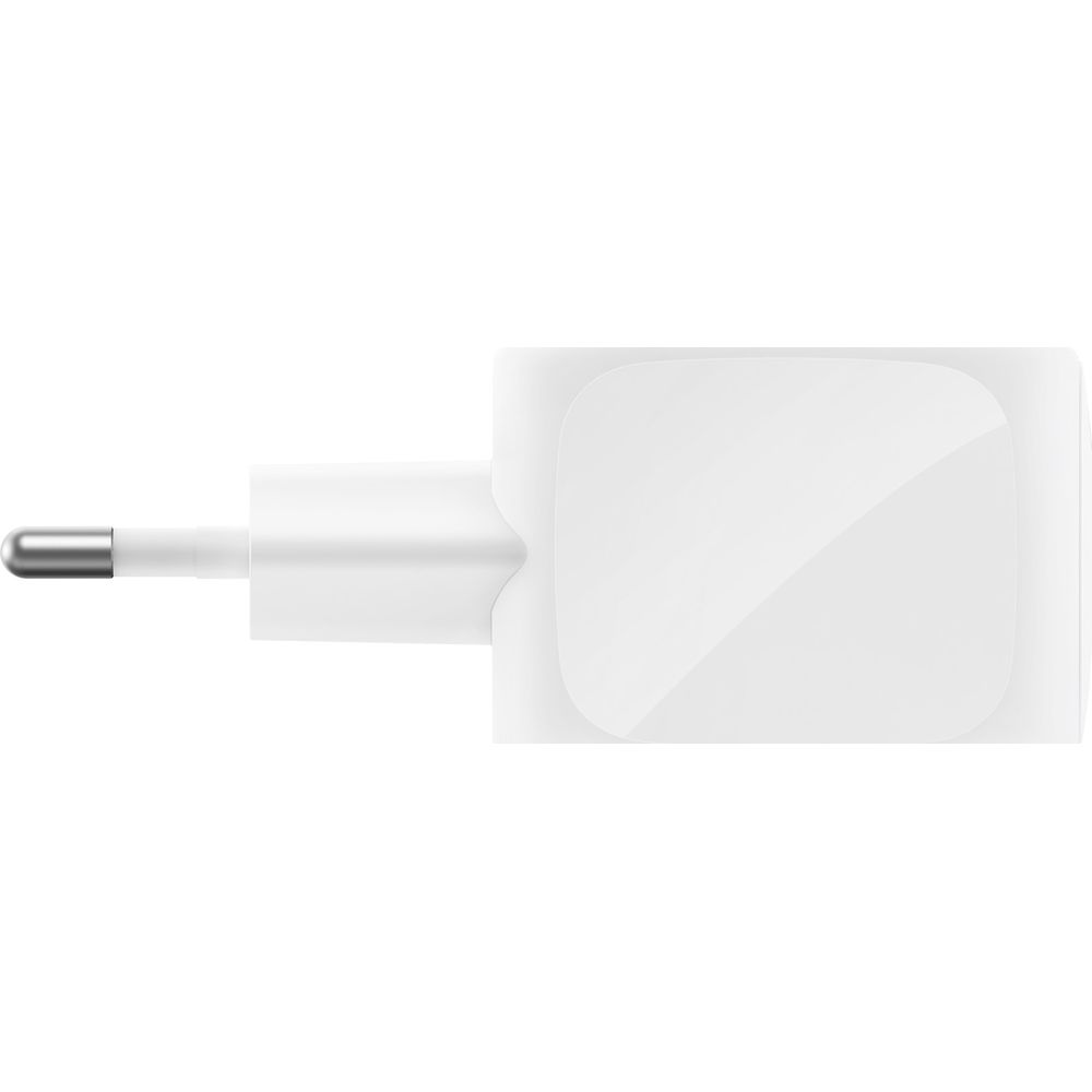 Un alimentatore bianco con due pin rotondi su sfondo bianco.