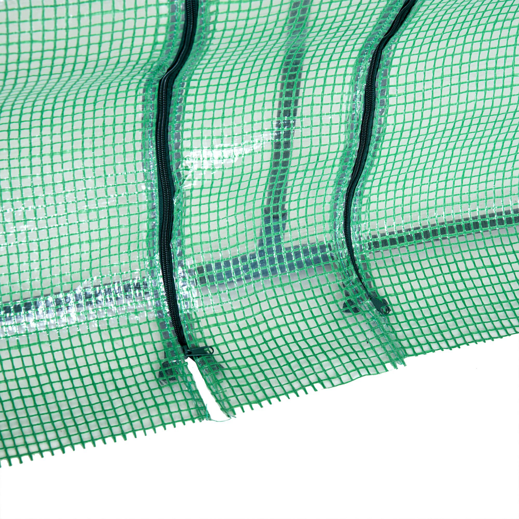 Tejido de malla verde con cremalleras, parte de un invernadero.