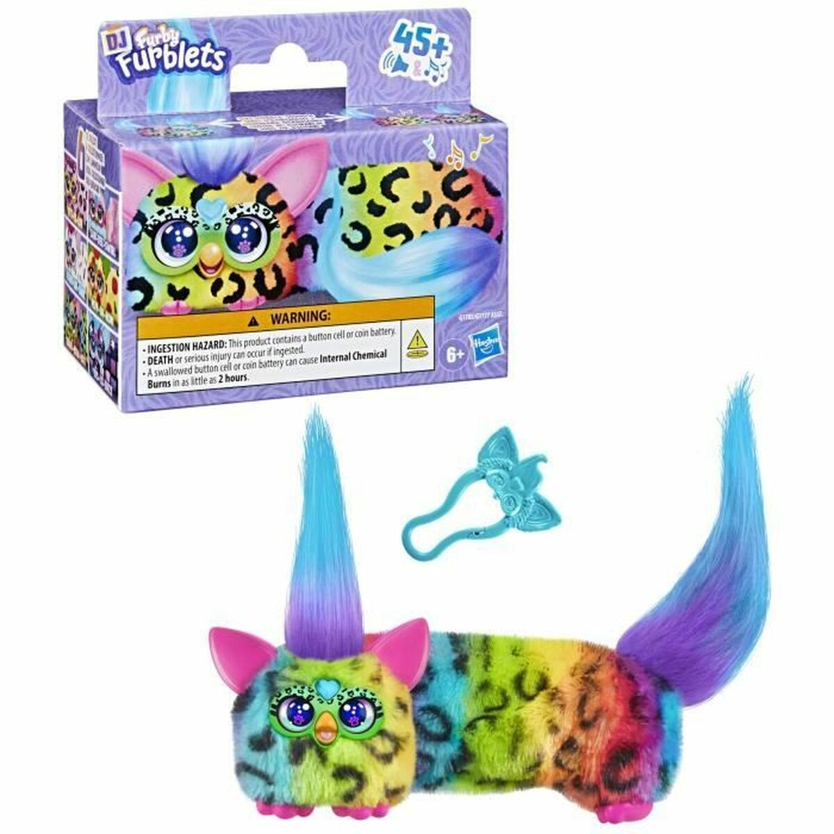Ein bunter Furby mit Leopardenmuster und blauer Mähne, mit Verpackung und Accessoires.