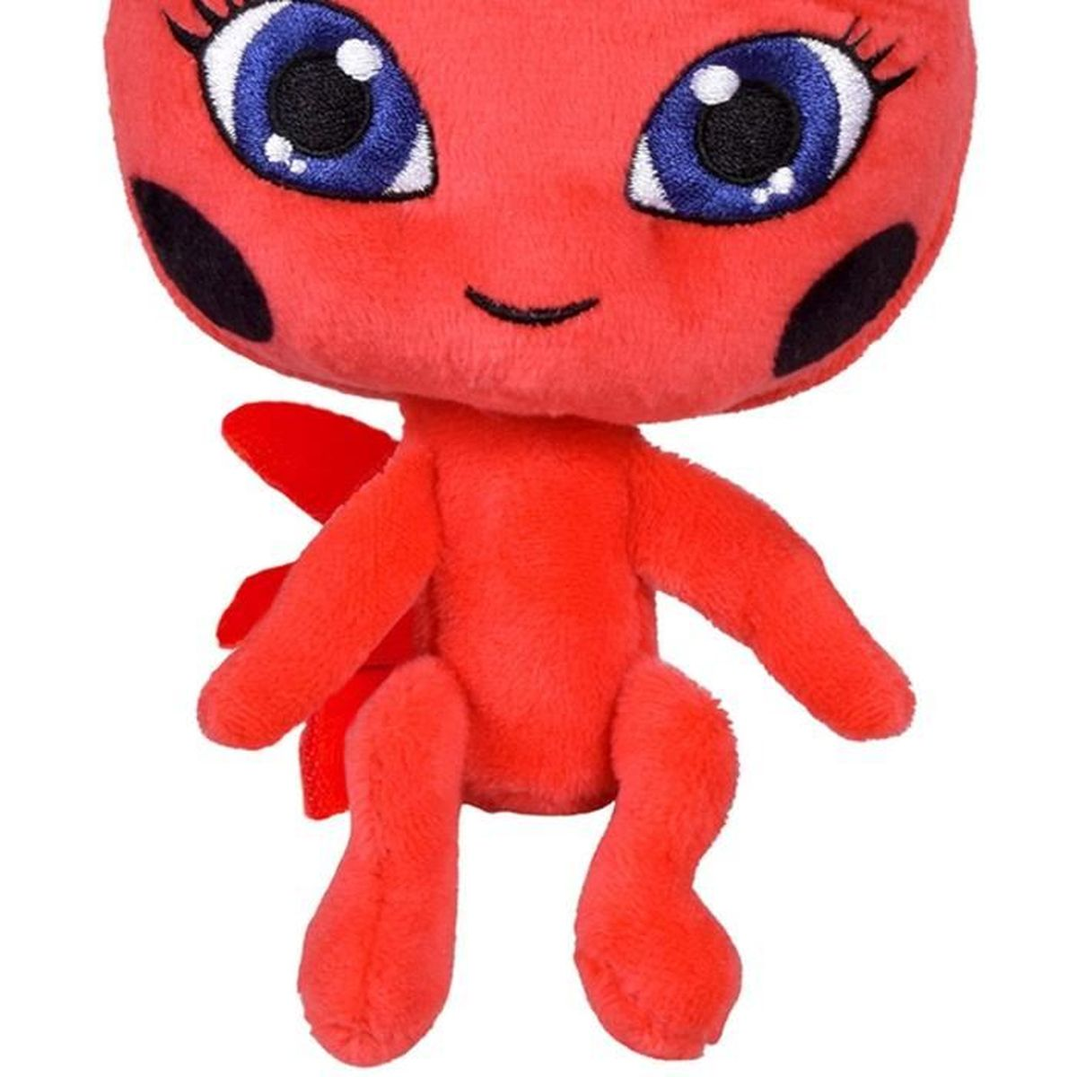 Une peluche rouge avec de grands yeux bleus et des points noirs.