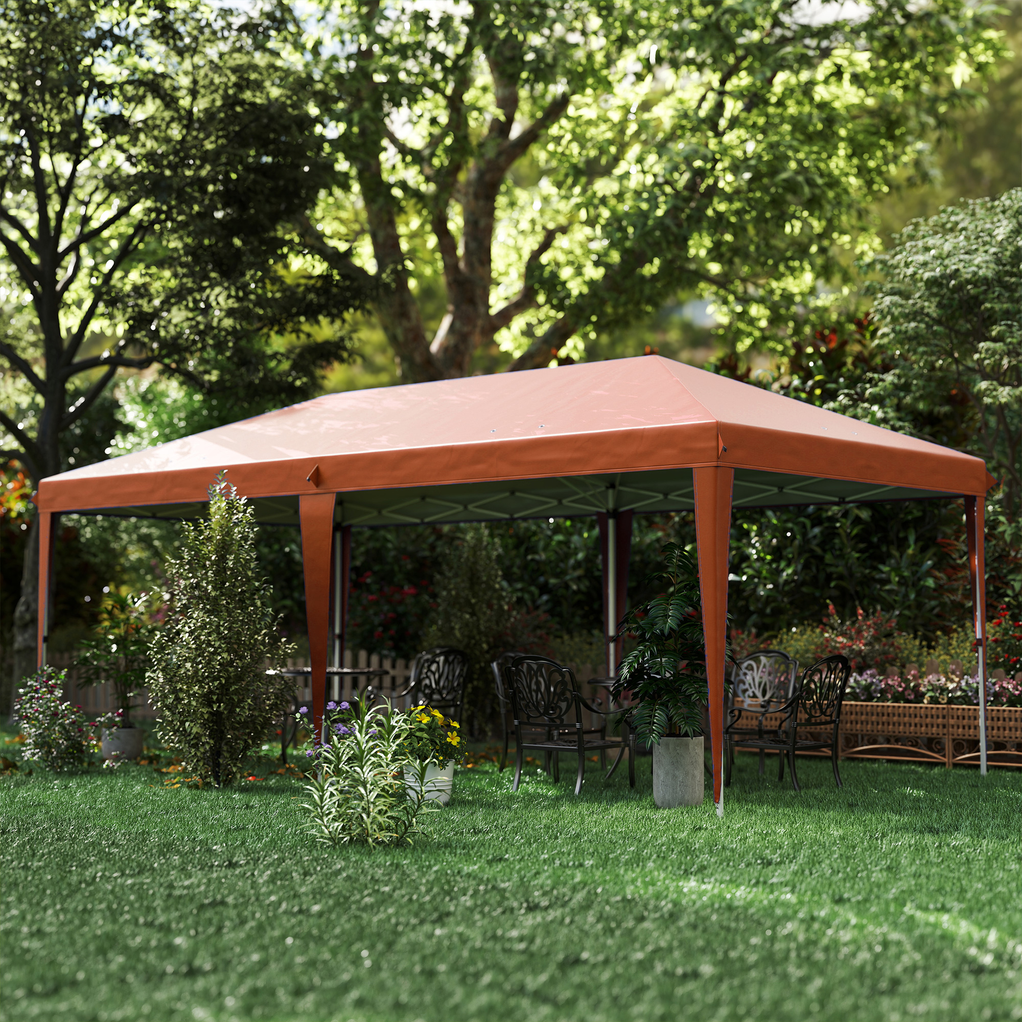 Una carpa naranja se alza sobre un césped verde con muebles de jardín.
