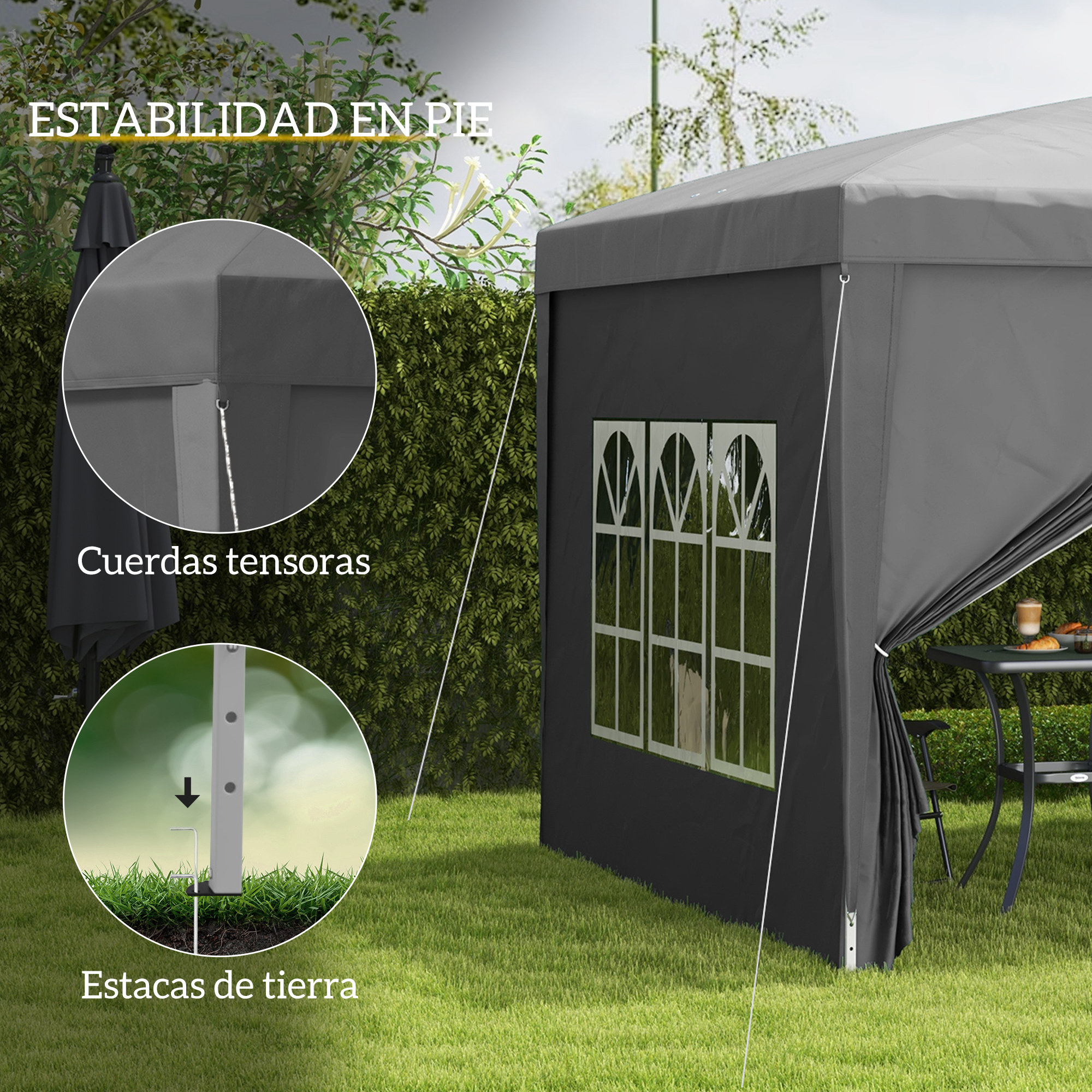 Un gazebo gris con ventanas se alza en un jardín. Primeros planos muestran cuerdas tensoras y estacas.