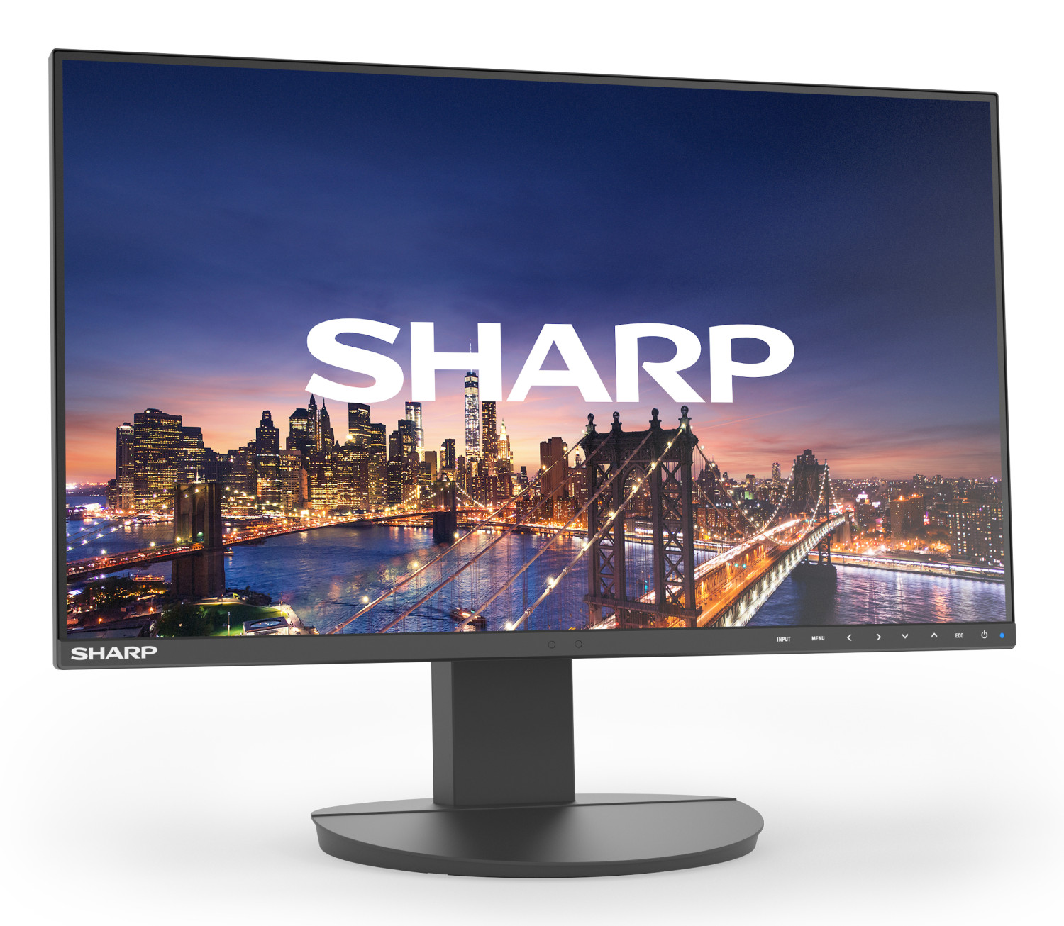 Un monitor mostra uno skyline cittadino di notte con ponti e luci.