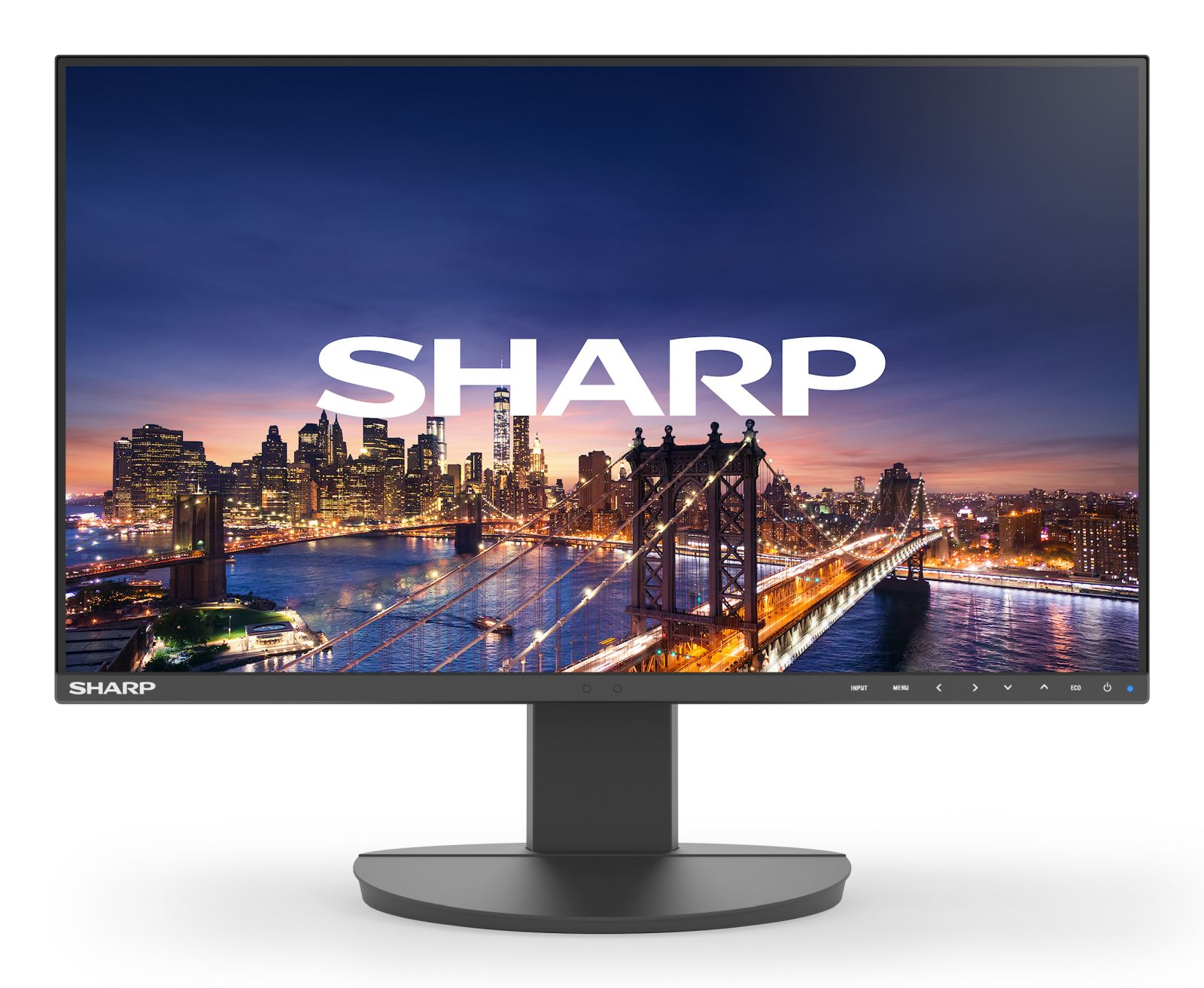 Ein Monitor zeigt eine beleuchtete Stadt und eine Brücke bei Nacht.