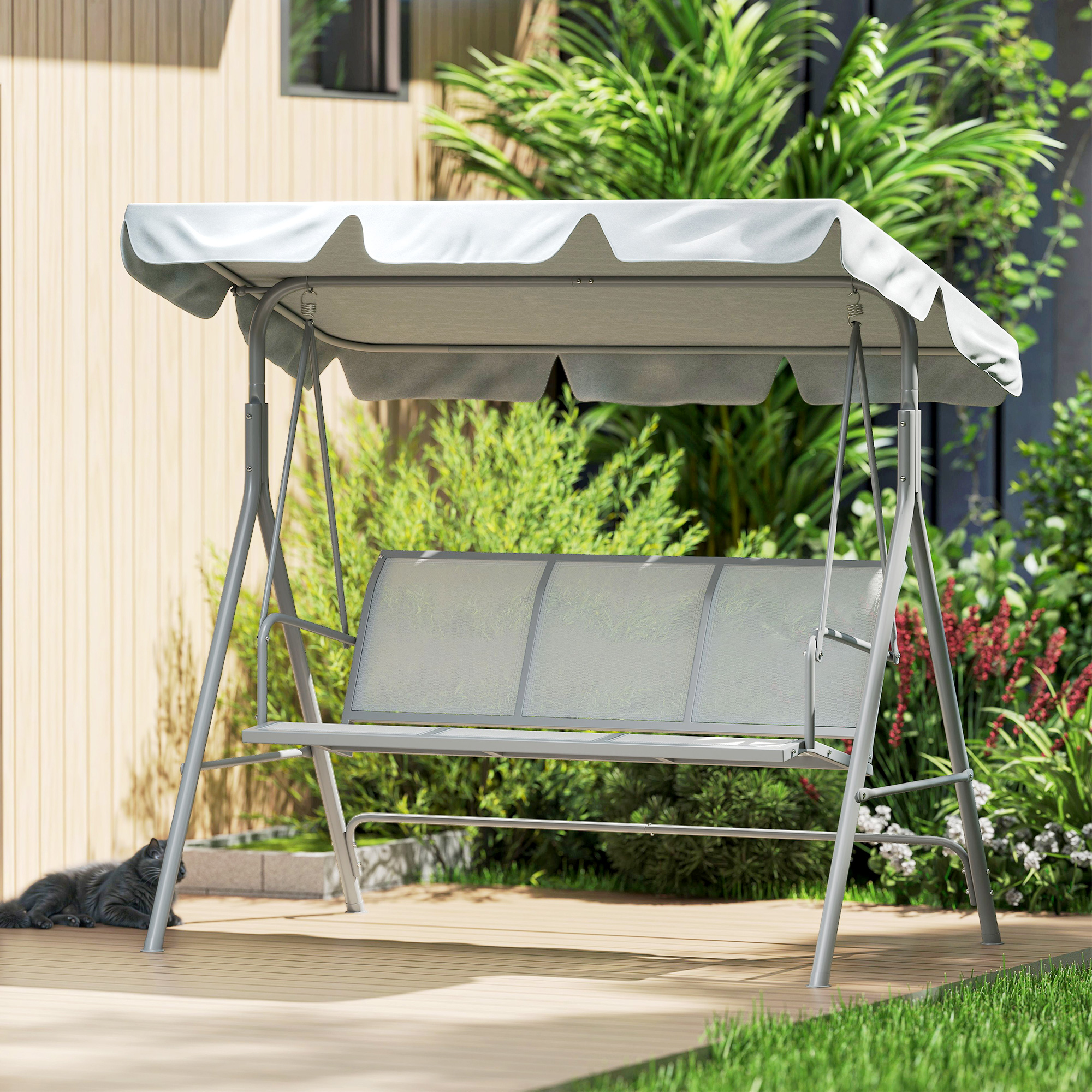 Un divano da giardino a dondolo grigio con tettoia è su un ponte di legno.