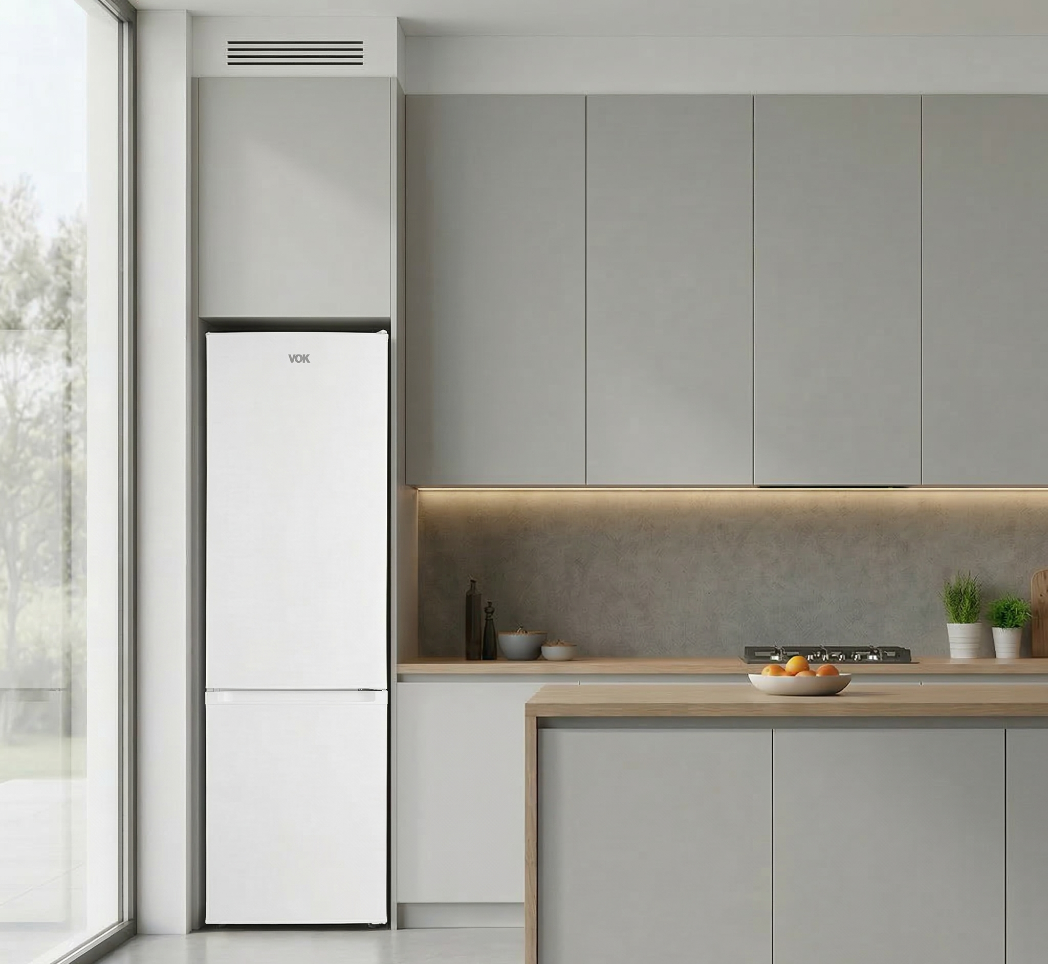 Cocina moderna con refrigerador blanco, gabinetes grises y encimera de madera.