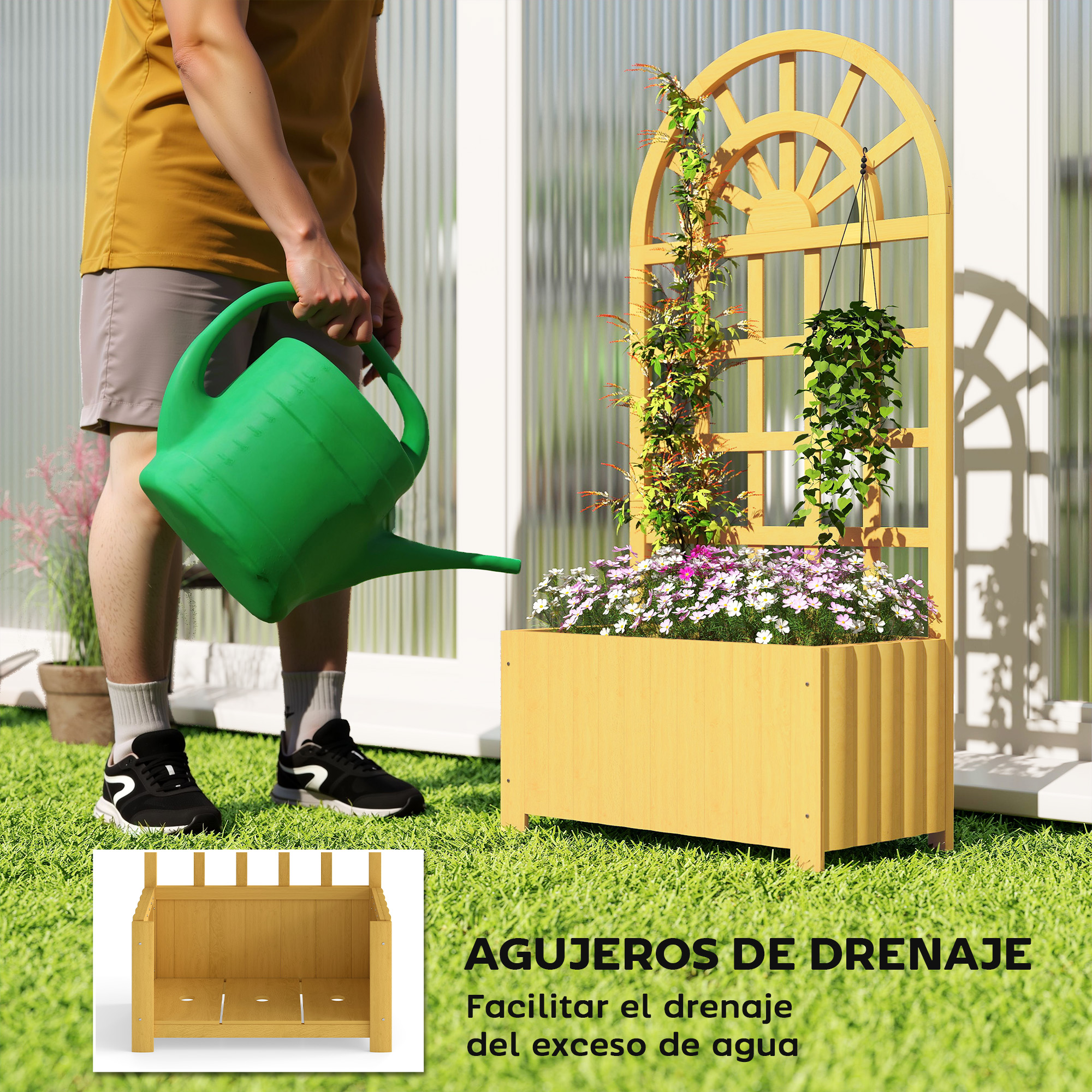 Un hombre riega plantas en una jardinera de madera con una regadera verde.