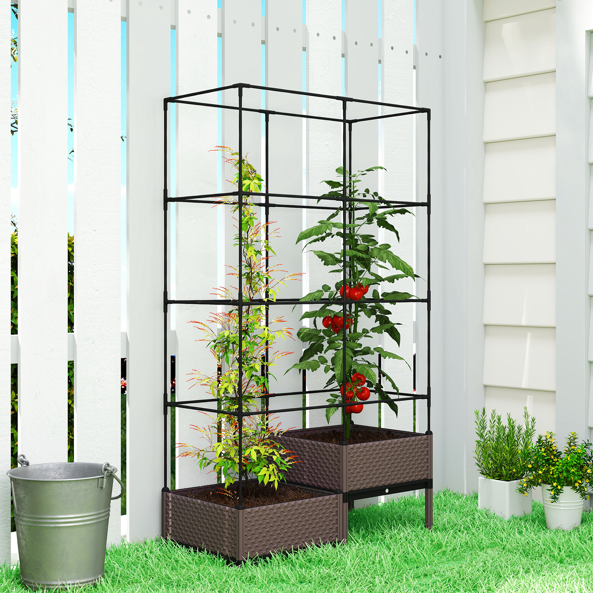 Dos plantas crecen en macetas marrones bajo una estructura de metal negra.
