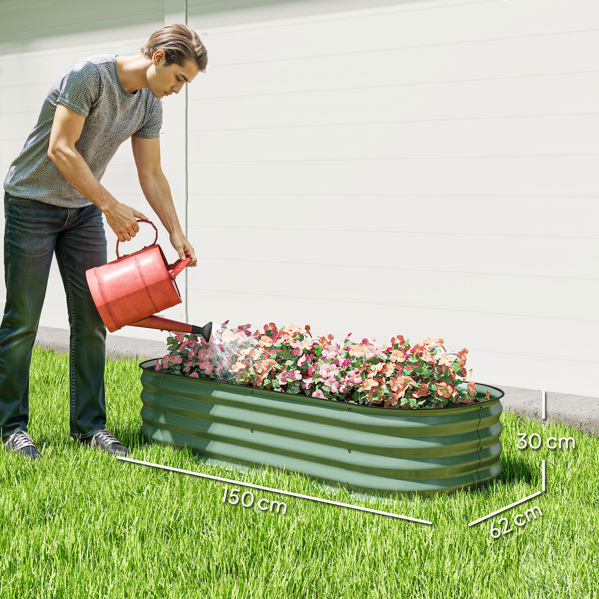 Un hombre riega flores en un bancal elevado verde con una regadera roja.