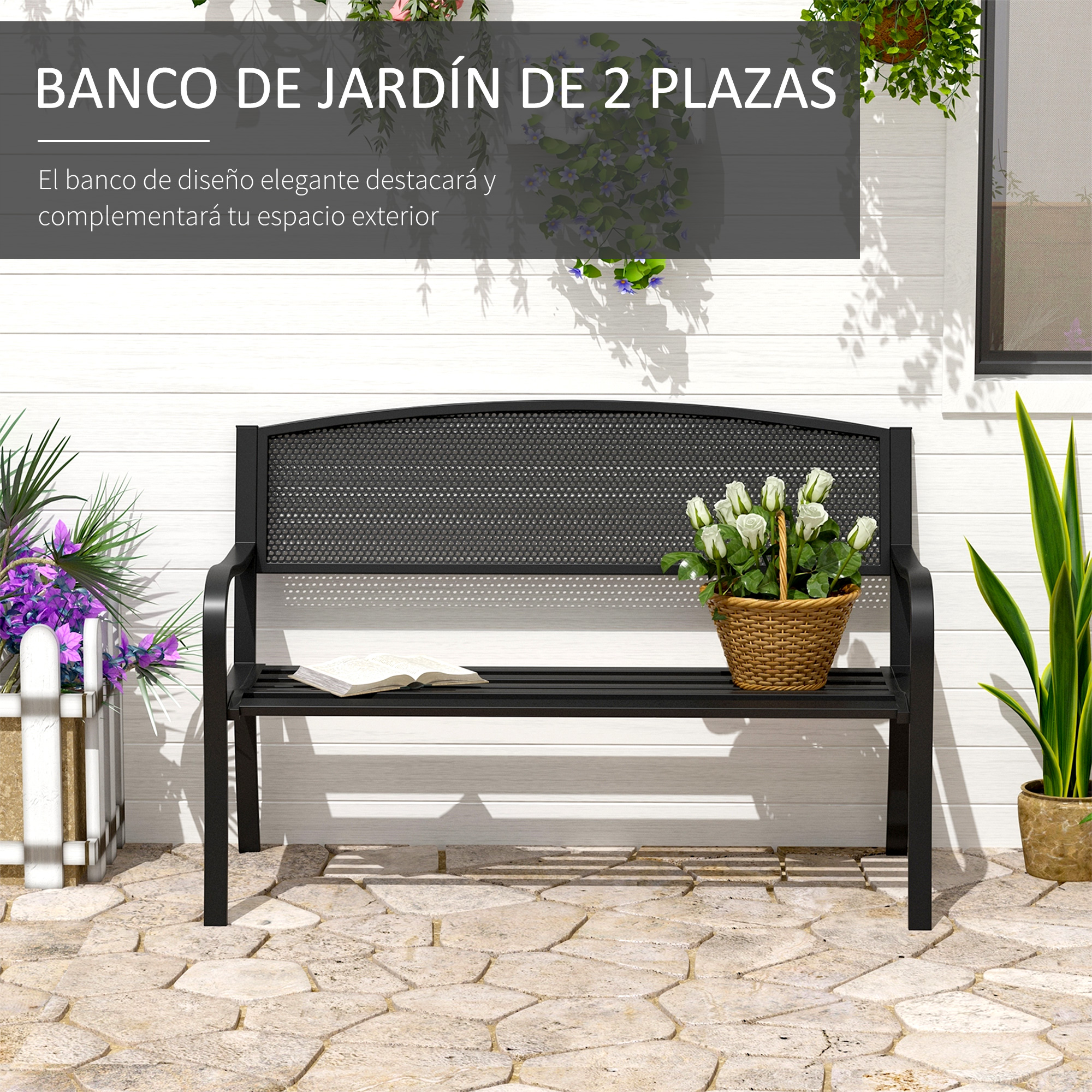 Banco de jardín negro con cesta de flores y libro en patio pavimentado.