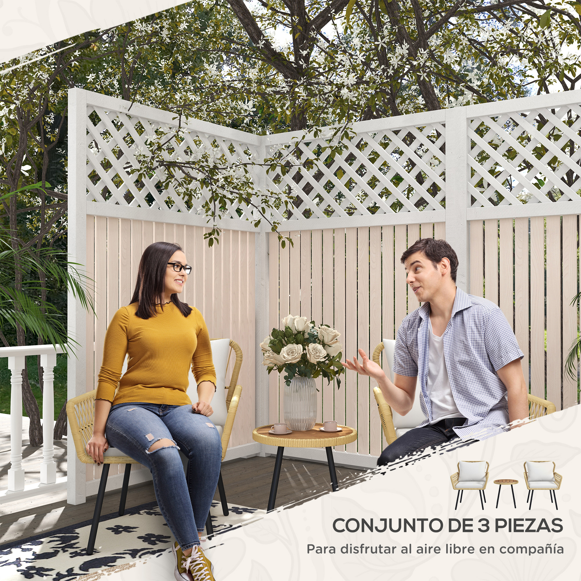 Hombre y mujer sentados en muebles de patio bajo árbol en flor.