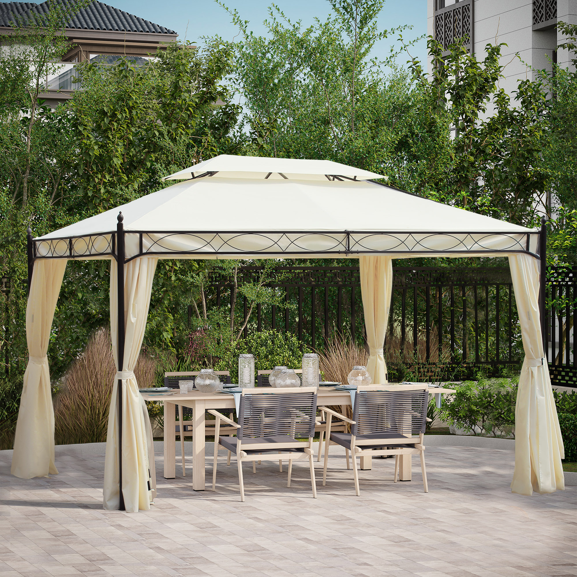Un cenador beige con mesa y sillas se encuentra en un patio pavimentado al aire libre.
