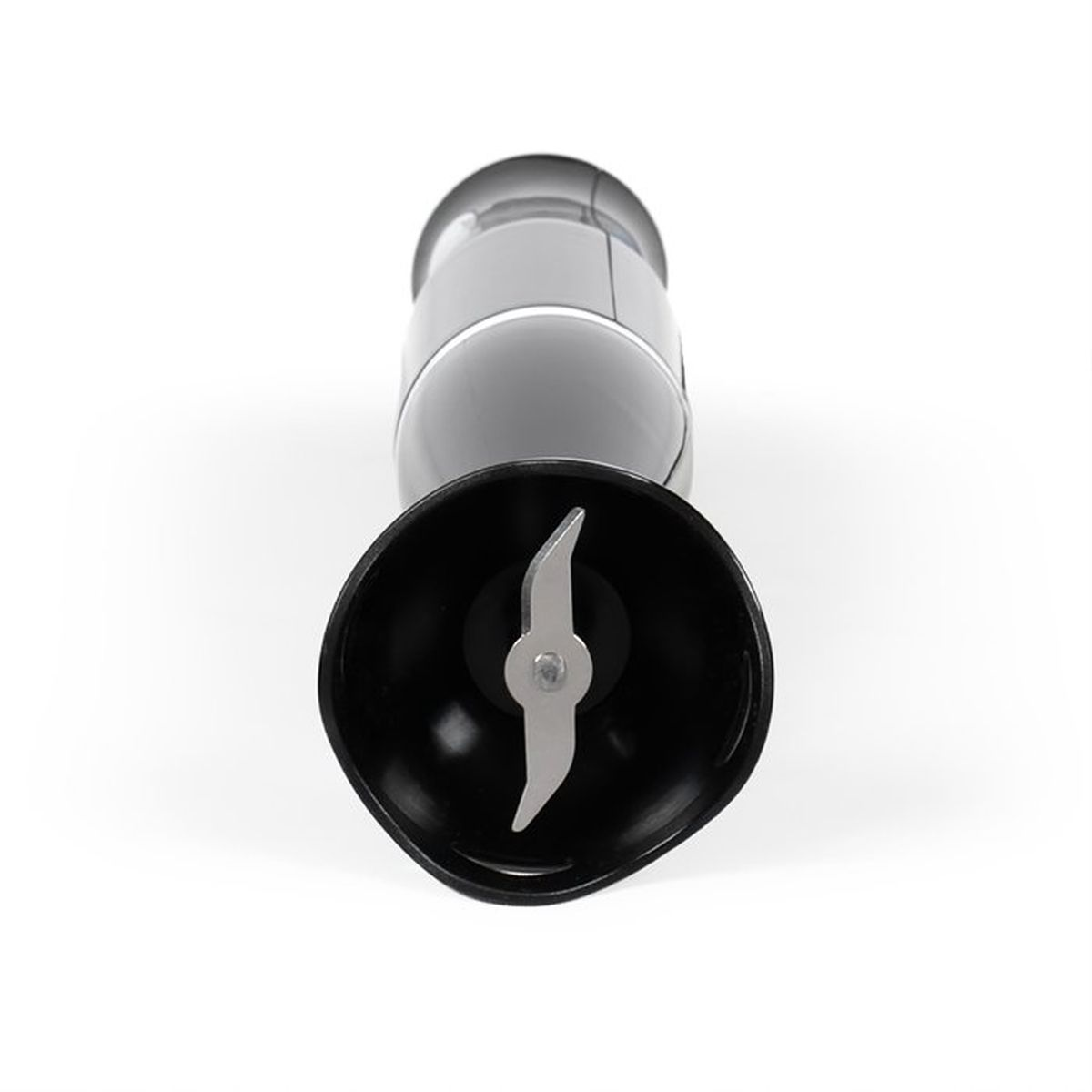 Close-up of a black immersion blender with metal blades on a white background.