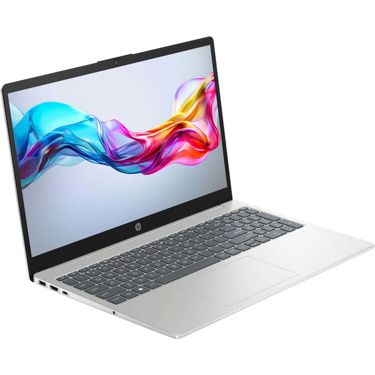 Srebrny laptop z kolorową abstrakcyjną tapetą i klawiaturą.