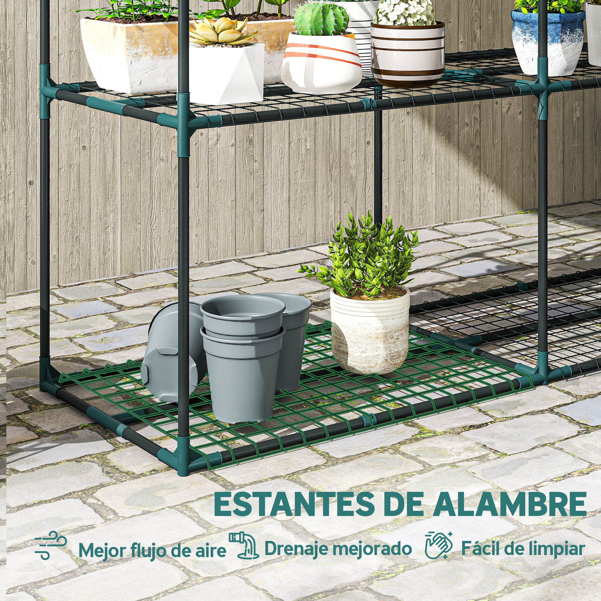 Estante de alambre verde con plantas y macetas sobre suelo pavimentado.