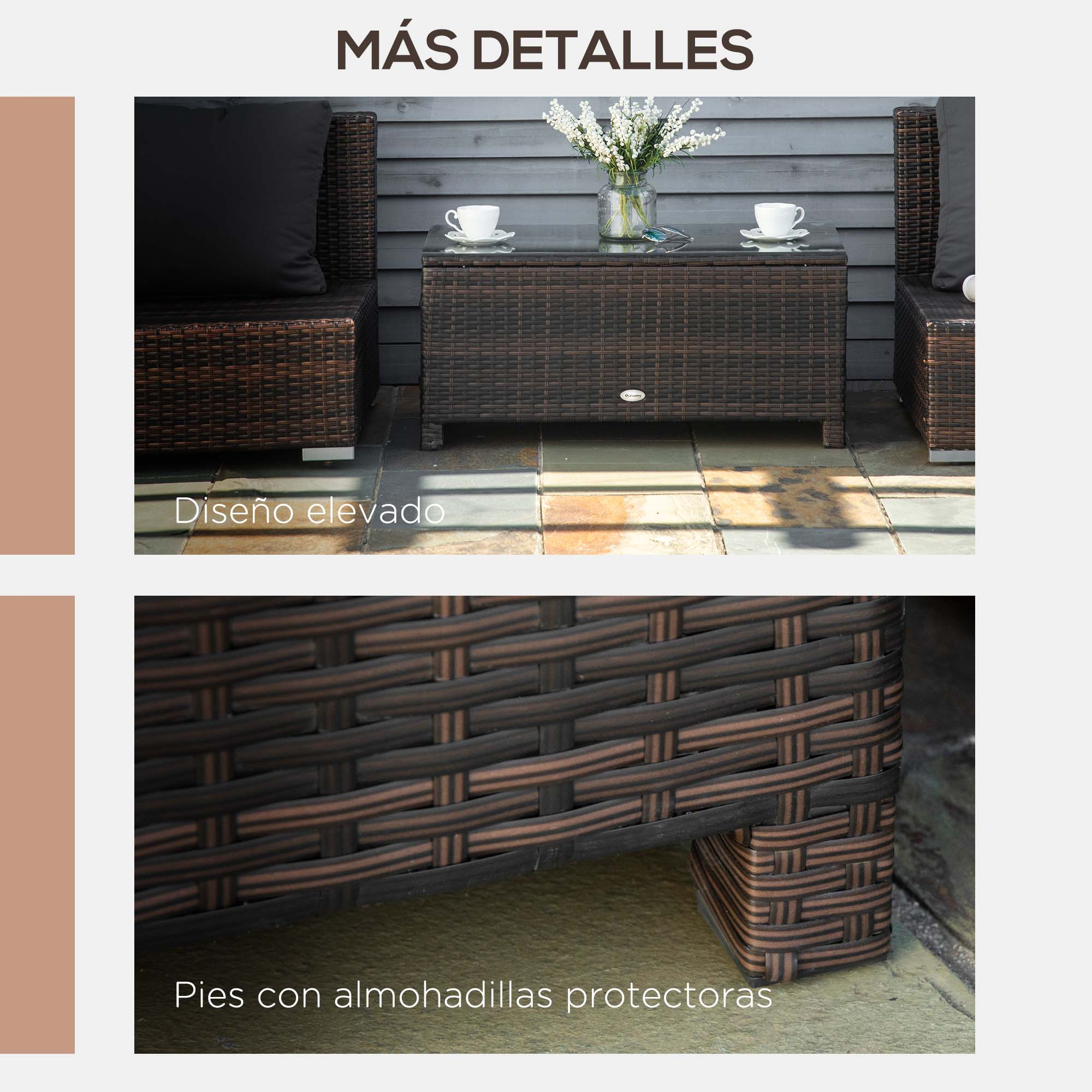 Sofá de ratán marrón con cojines negros y mesa con flores.