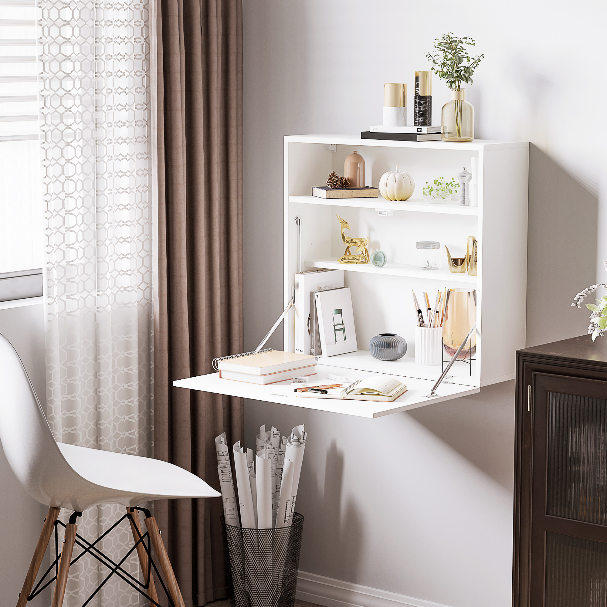 Un escritorio blanco de pared con frente abatible, decorado con libros y jarrones.