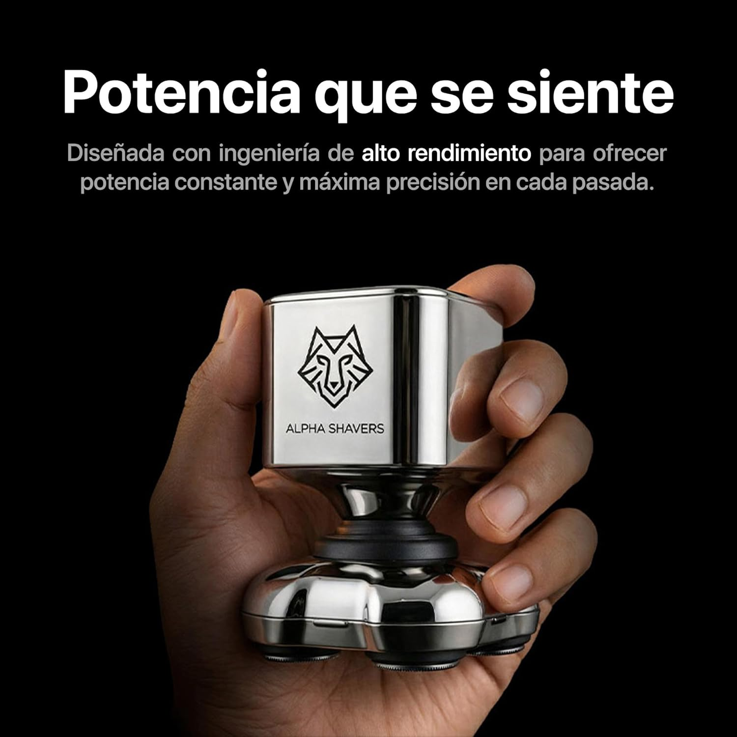 Una mano sostiene una afeitadora plateada con logo de lobo y texto 'ALPHA SHAVERS'.