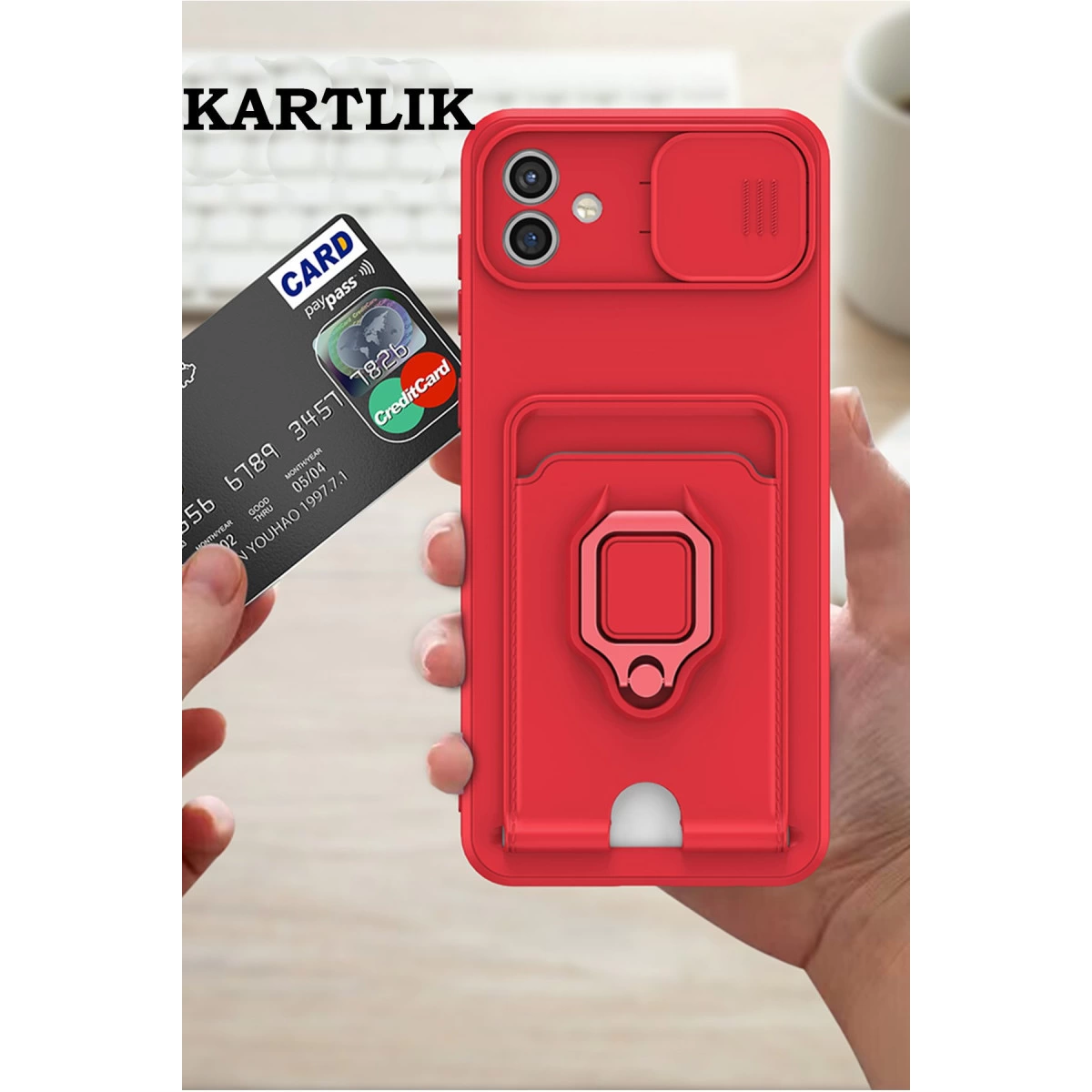 Kart tutuculu, halkalı ve kamera kapaklı kırmızı telefon kılıfı.