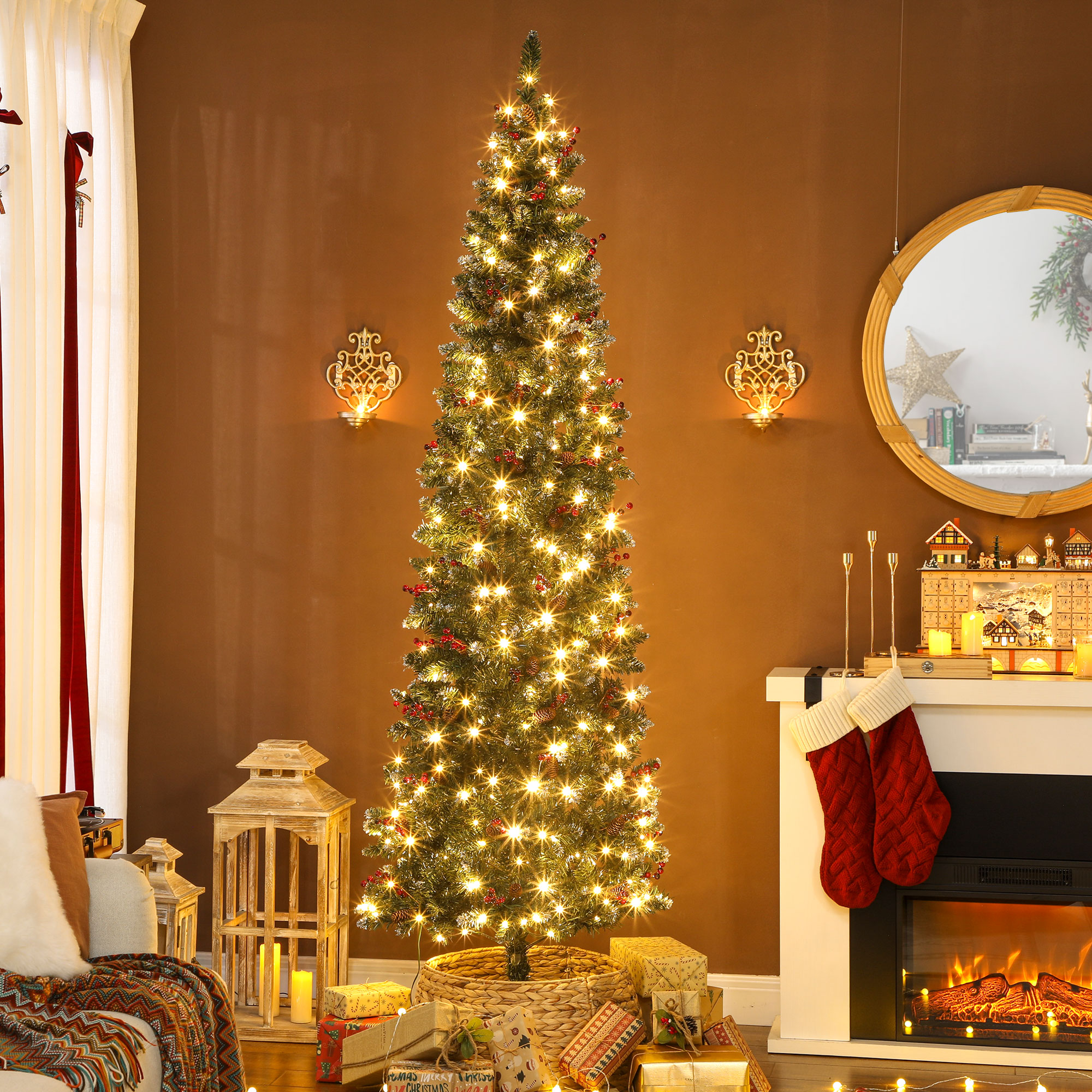 Un árbol de Navidad decorado con luces, regalos y adornos.