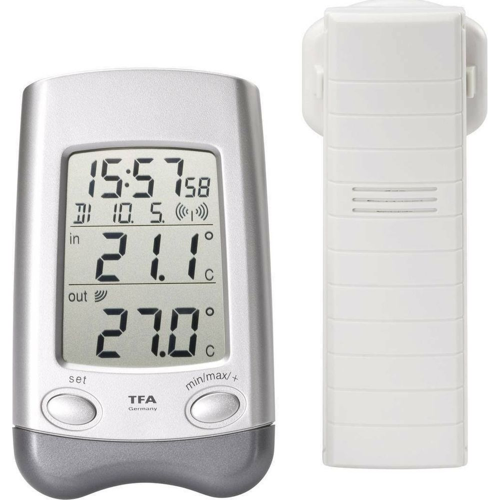 Un thermomètre numérique avec capteur externe affiche 21.1°C intérieur et 27.0°C extérieur.