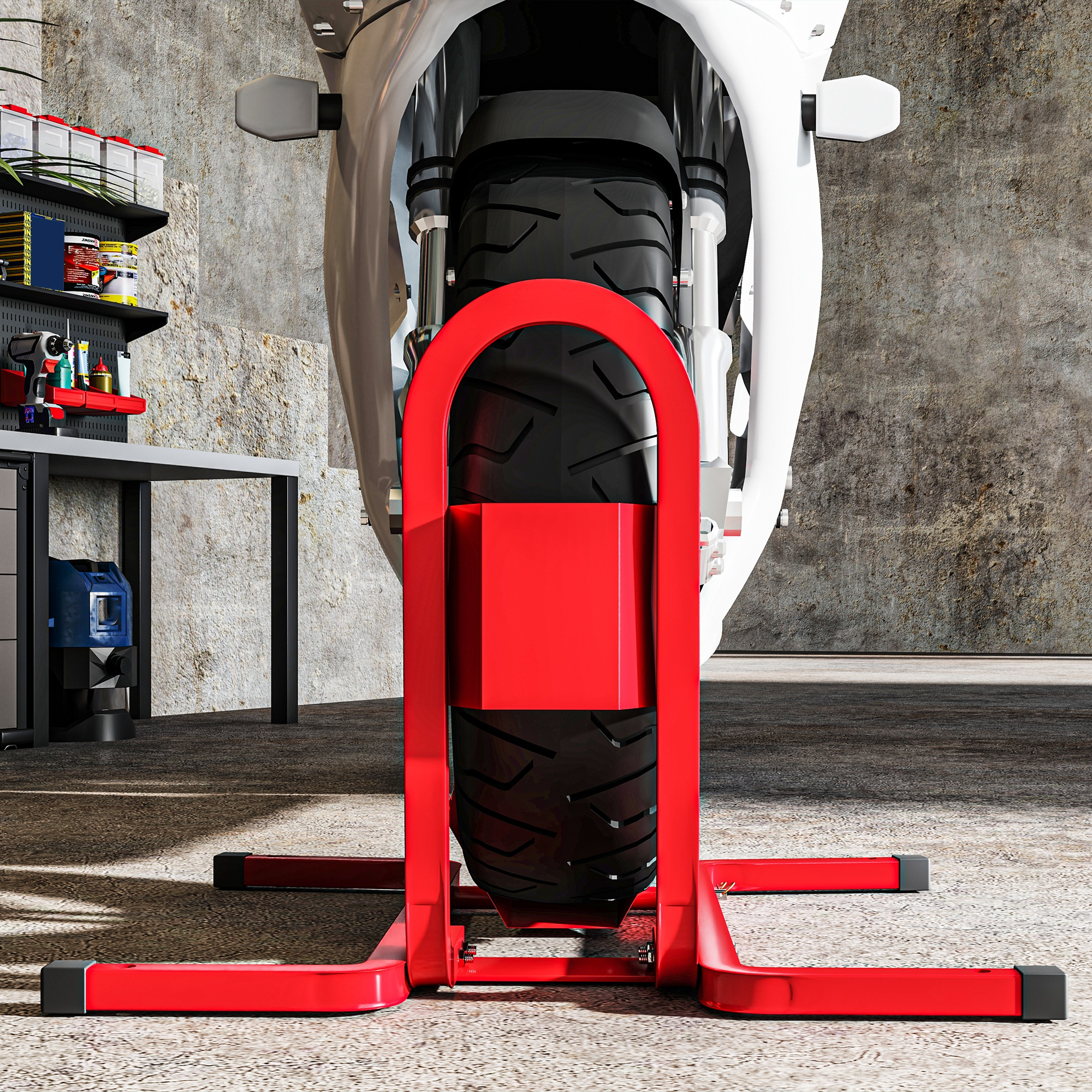 Neumático de moto en soporte rojo contra pared de hormigón, banco de trabajo.