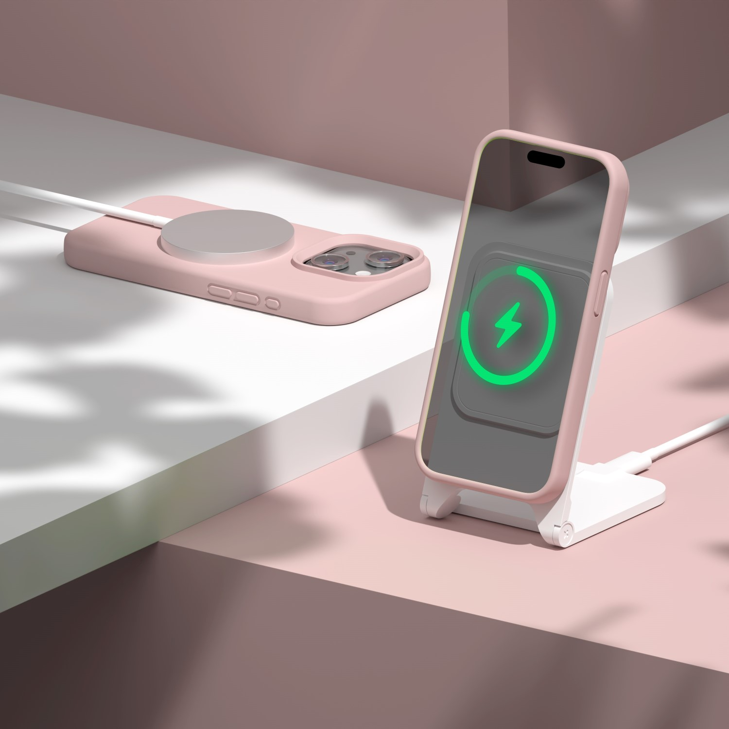 Un telefono rosa su un caricabatterie bianco con icona di ricarica. Un altro telefono rosa è lì vicino.