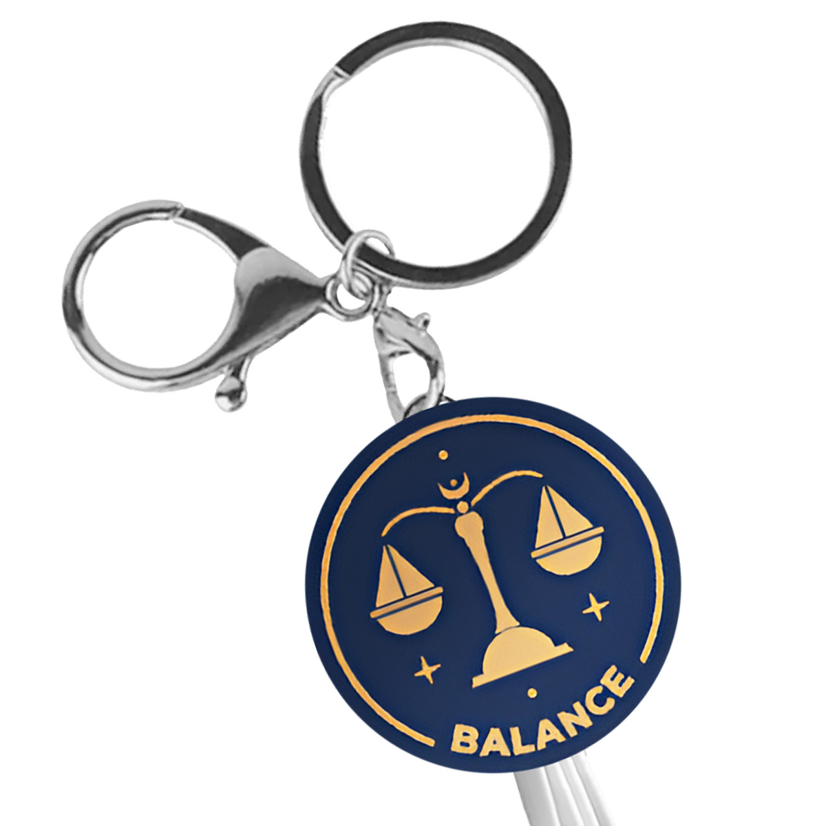 Un portachiavi circolare blu scuro con una bilancia dorata della giustizia e la parola BALANCE.