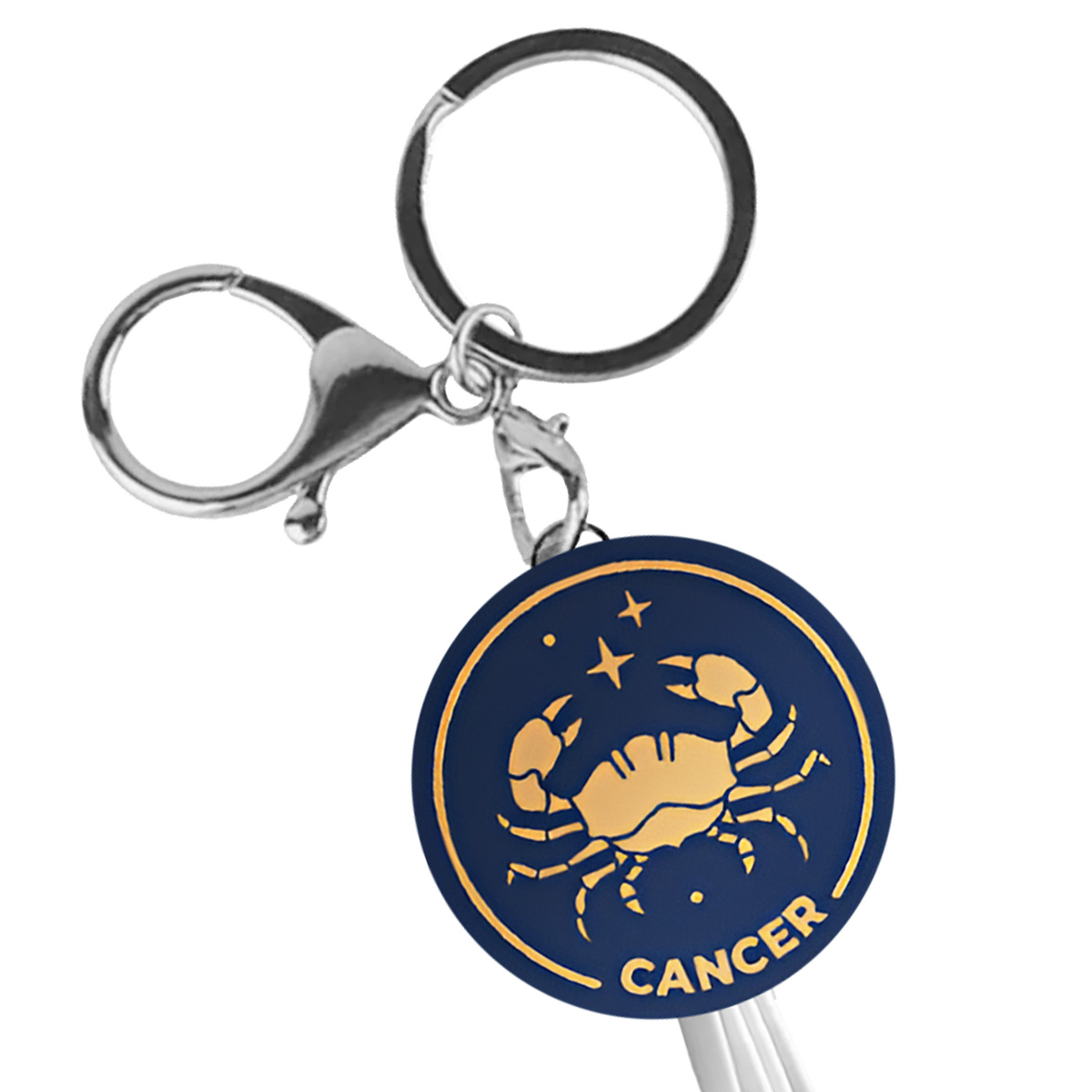 Porte-clés avec symbole de crabe et étoiles sur fond bleu foncé.