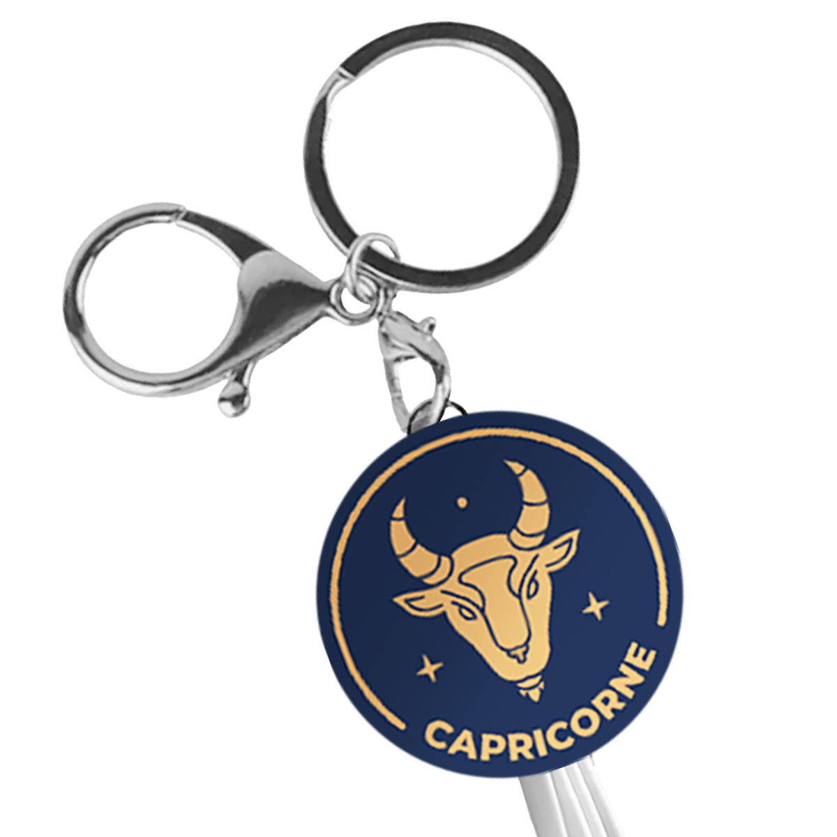 Un portachiavi con simbolo Capricorno su sfondo blu scuro.