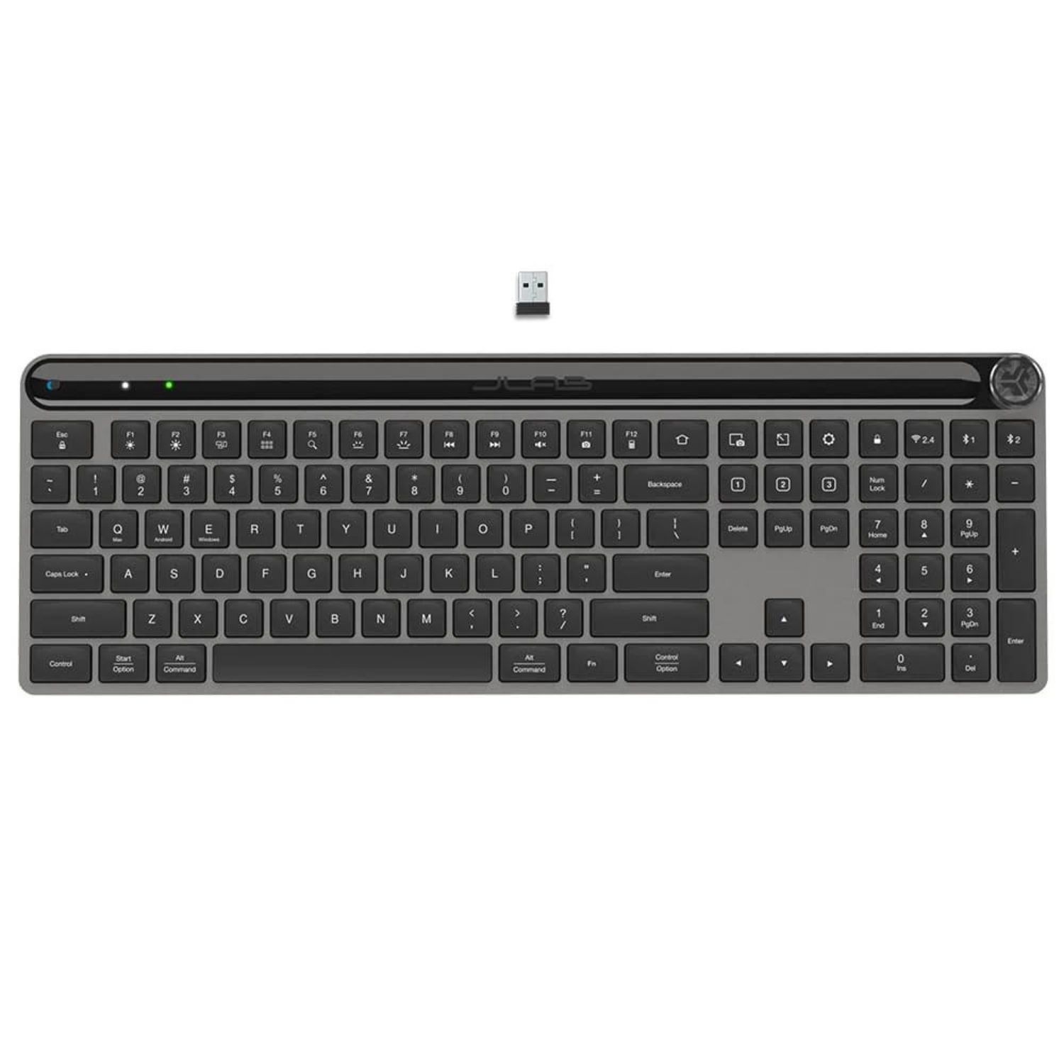 Una tastiera grigia con un piccolo ricevitore USB in cima.